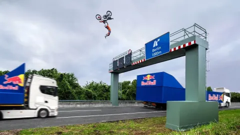 Daredevil Performs World First Backflip Between Two Moving Trucks