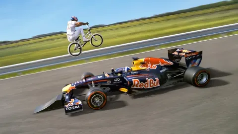 BMX Rider Attempts World First Jump Over a Moving Formula 1 Car
