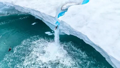 Kayaking Off an Arctic Ice Wall Waterfall in Svalbard