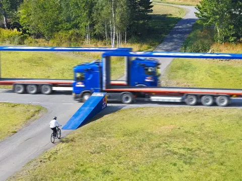 Bike Stunt Through Moving Trucks: The Impossible Gap Challenge