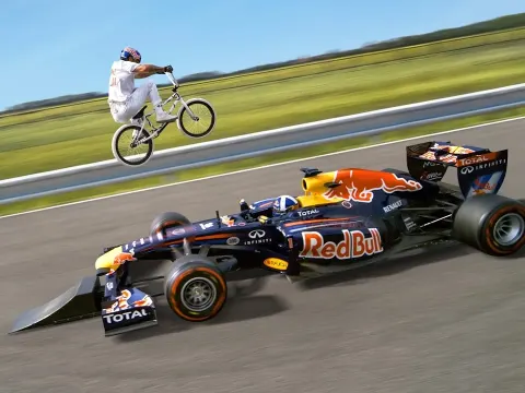 BMX Rider Attempts World First Jump Over a Moving Formula 1 Car